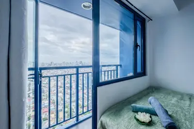 a room with a window with a view of the city at Home with Best Sunset of Manila Bay and Sea view! in Manila