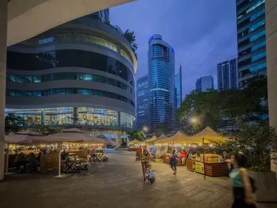 people walking around an outdoor market in a city at Home with Best Sunset of Manila Bay and Sea view! in Manila