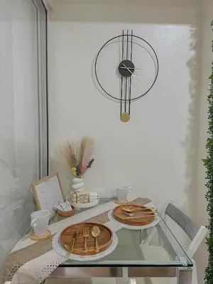 a glass table with a plate of food on it at The Sandscape Suite in Manila