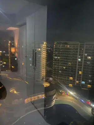 a view of a city at night from a building at 2bedroom azure beach 5 in Manila