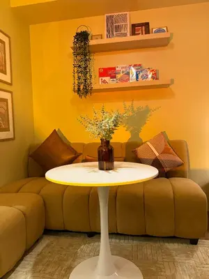 a living room with a table in front of a couch at Serenity Stays at Red Residences in Manila