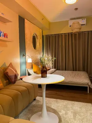 a living room with a table and a couch at Serenity Stays at Red Residences in Manila