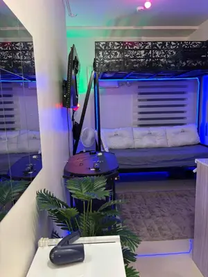 a room with a bed and a desk with a computer at Urban Deca Tower Cubao - Affordable Condo Unit for Transient in Manila
