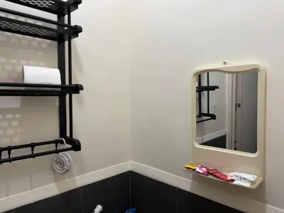 a bathroom with a mirror and a sink at Urban Deca Tower Cubao - Affordable Condo Unit for Transient in Manila