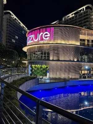 a building with a sign on the side of it at Azure Staycation by Leojen in Manila