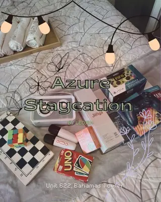 a pile of books sitting on top of a bed at Azure Staycation by Leojen in Manila