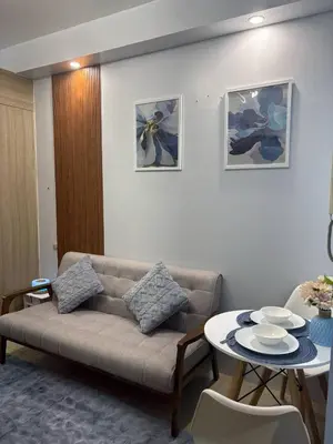 a living room with a couch and a table at Azul Paradise in Manila