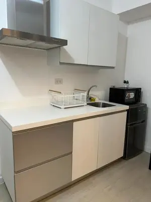 a kitchen with a sink and a counter top at SM Bicutan Boracay Tower in Manila