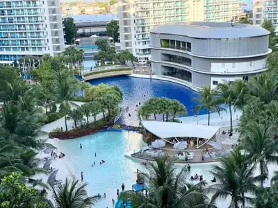 a large pool in a resort with people in it at SM Bicutan Boracay Tower in Manila