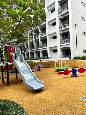 a playground with a slide in front of a building at Legit Staycation walking distance to Mall of Asia located in Shore1 and 2 Residences in Manila