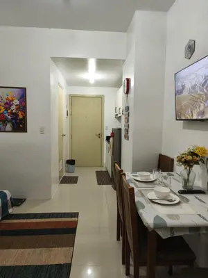 a dining room with a table and chairs at Condotel or apartment SM JAZZ RESIDENCES in Manila