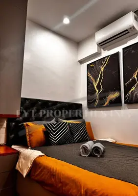 a bedroom with an orange bed with two posters on the wall at Modern Comfort at MOA Shore 3 in Manila