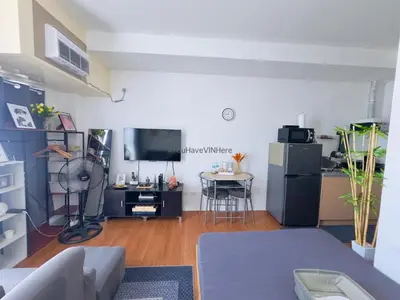 a living room with a couch and a table at You Have VIN Here in Manila