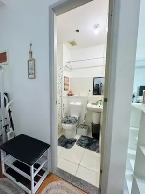 a bathroom with a toilet and a sink at You Have VIN Here in Manila