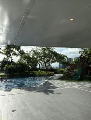a swimming pool with a slide and a playground at Solace Haven in Manila