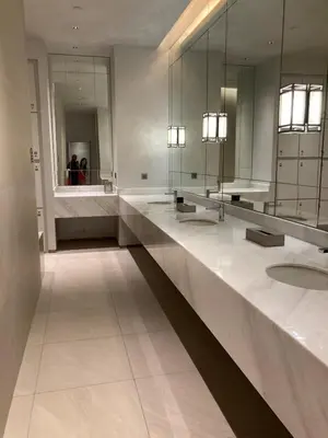 a bathroom with two sinks and a large mirror at Luxury Condo at Century Spire in Central Makati in Manila