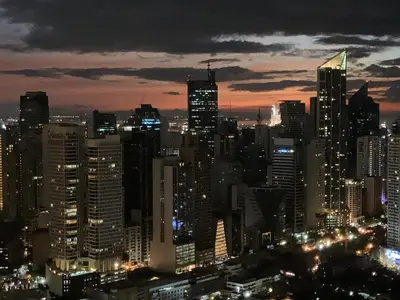 a night view of a large city at night at Luxury Condo at Century Spire in Central Makati in Manila
