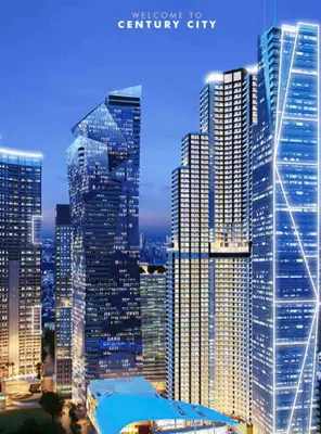 a group of tall buildings in a city at night at Luxury Condo at Century Spire in Central Makati in Manila