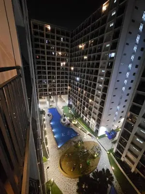 an aerial view of a large building with a pool at The Executive Suites at Shore 2 Residences in Manila
