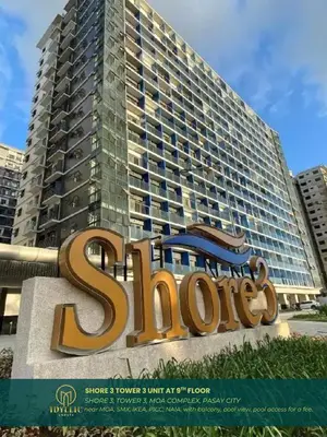 a sign in front of a large building at Shore 3 Residences Spacious & Spotless 1BR unit near airport MOA SMX in Manila