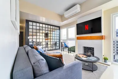 a living room with a couch and a fireplace at Bayshoreluxe in Manila