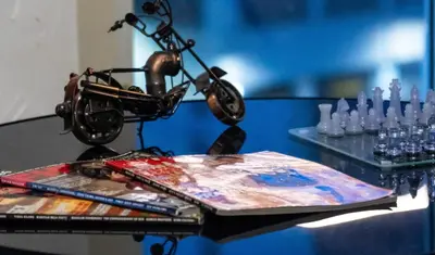 a table with a painting and a bike on it at Bayshoreluxe in Manila