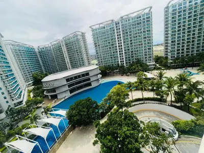 an aerial view of a resort with tall buildings at Rhome Staycation by Azure St Tropez Tower Beach View Condo Unit in Manila