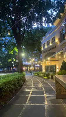 a street in front of a building at night at BGC Condominium Near St Luke Fort Bonifacio Taguig in Manila