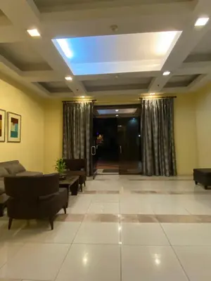 a lobby with couches and a blue light on the ceiling at BGC Condominium Near St Luke Fort Bonifacio Taguig in Manila