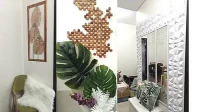 a living room with a mirror and some plants at Condo Free Pool Fast Wi-fi near BGC, C5 in Manila