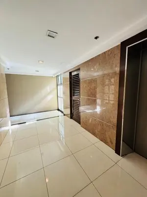 a large room with a shower and a tiled floor at Avant at the Fort BGC with King Bed and Motorized Curtains & 65 in TV in Manila