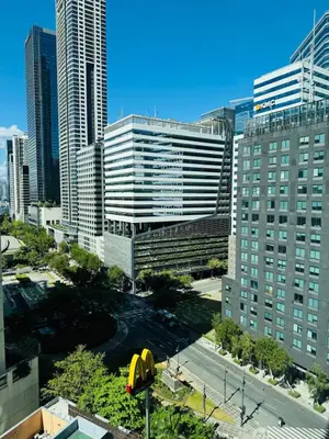 a view of a city skyline with tall buildings at Avant at the Fort BGC with King Bed and Motorized Curtains & 65 in TV in Manila