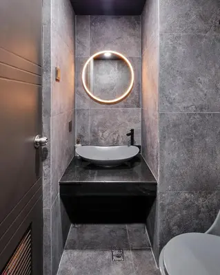 a bathroom with a sink and a mirror at Luxury Condo in the heart of BGC in Manila