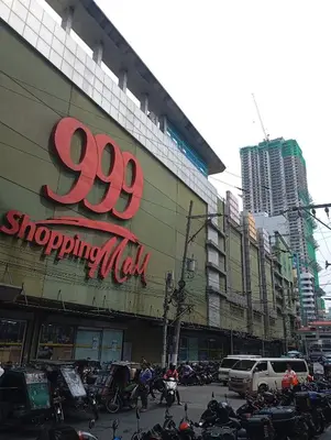 a group of motorcycles parked in front of a shopping mall at Pristine Hotel in Manila