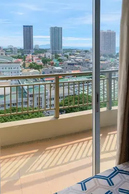 a balcony with a view of a city at La Suitez 1421 l Sky Studio l 360 City l Sea View in Manila