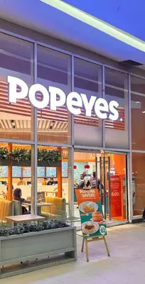 a pepys store with a sign in front of it at Stylish Makati 2BR Condo with KTV and Awesome Pools! in Manila
