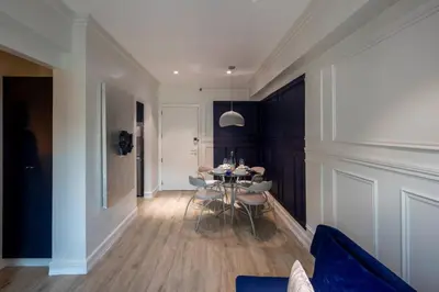 a dining room with a table and chairs at BGC Designer Pad Near Shops Dining Nightlife in Manila