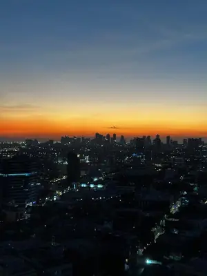 a view of a city skyline at sunset at Casa La Vista in Manila