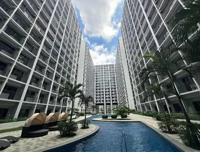a street in a city with tall buildings at The Residence Suite in Manila