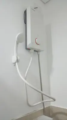 a camera on the wall of a room at Happy Stays E - 300mbps - 65