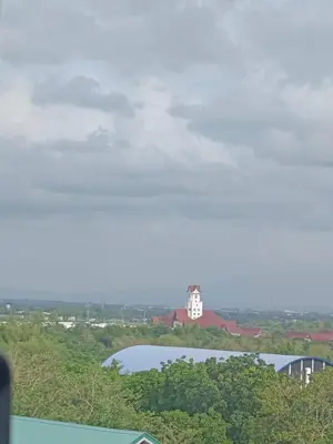 a view of a clock tower and a lake at Happy Stays E - 300mbps - 65