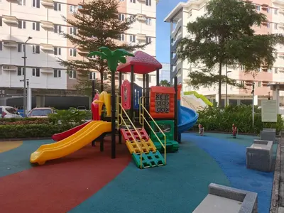 a playground with a slide in a park at Happy Stays E - 300mbps - 65