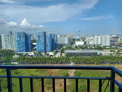 a view of a city from a balcony at Len's Den 3 Entire Flat in Mall of Asia Pasay Manila in Manila