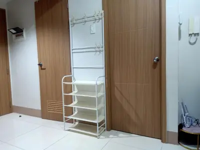 a white refrigerator with shelves next to a door at Len's Den 3 Entire Flat in Mall of Asia Pasay Manila in Manila