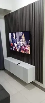 a flat screen tv sitting on top of a white entertainment center at S Residences Tower 1 Staycation in Manila