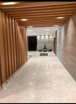an empty hallway of an office building with a lobby at S Residences Tower 1 Staycation in Manila
