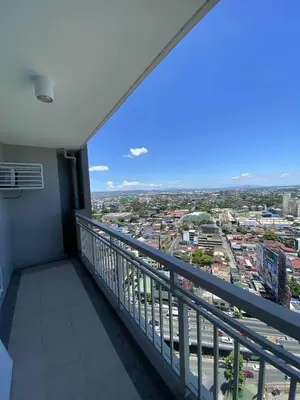a balcony with a view of a city at Family-Ready Skyline Retreat near BGC with Free Parking in Manila