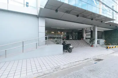 a motorcycle parked in front of a building at Maine Residences Tramo near NAIA Terminal in Manila