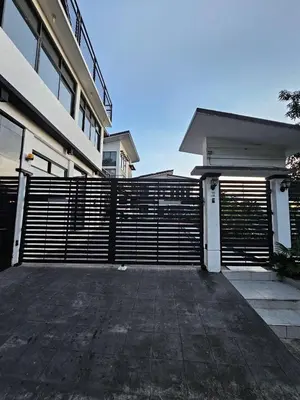 a fence in front of a building at Casa Prinza Luxury Suite in Teresa