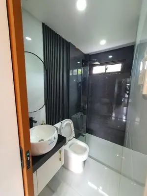 a bathroom with a toilet and a sink at Casa Prinza Luxury Suite in Teresa